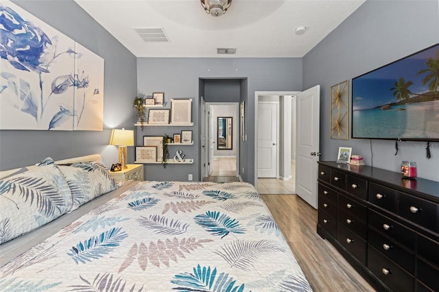 21167 Pleasant Plains Pkwy, Land O Lakes, FL 34637 - bedroom featuring wood finished floors and visible vents