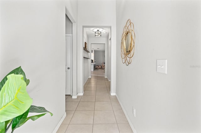 21167 Pleasant Plains Pkwy, Land O Lakes, FL 34637 - hallway featuring baseboards and light tile patterned flooring