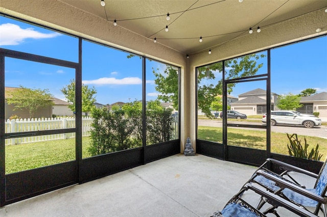 21167 Pleasant Plains Pkwy, Land O Lakes, FL 34637 - sunroom / solarium with a residential view and a ceiling fan