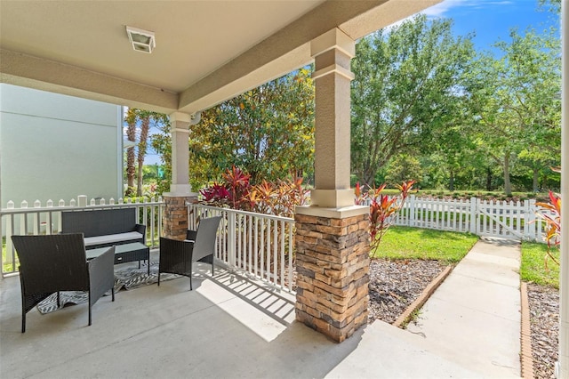 21167 Pleasant Plains Pkwy, Land O Lakes, FL 34637 - view of patio / terrace featuring fence and covered porch