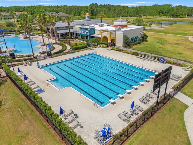 21167 Pleasant Plains Pkwy, Land O Lakes, FL 34637 - community pool with fence, a water view, and a yard