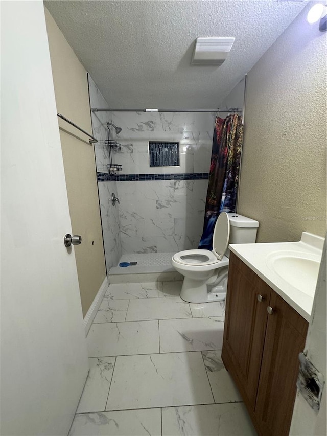 5316 Drift Tide Dr, New Port Richey, FL 34652 - full bath with toilet, a stall shower, a textured ceiling, marble finish floor, and vanity