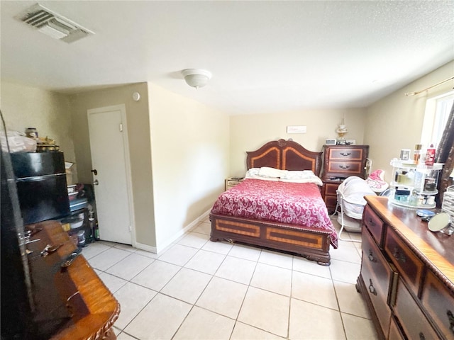 5316 Drift Tide Dr, New Port Richey, FL 34652 - bedroom featuring light tile patterned floors and visible vents