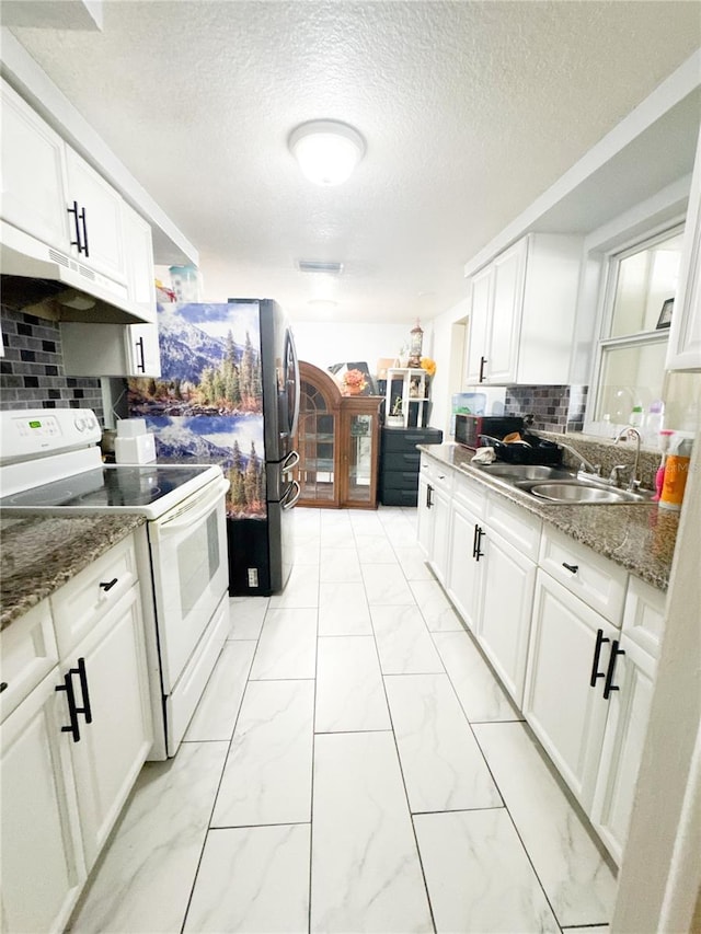 5316 Drift Tide Dr, New Port Richey, FL 34652 - kitchen with under cabinet range hood, marble finish floor, a sink, electric stove, and decorative backsplash