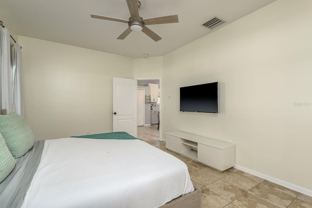 bedroom with baseboards, ceiling fan, light tile patterned flooring, and visible vents