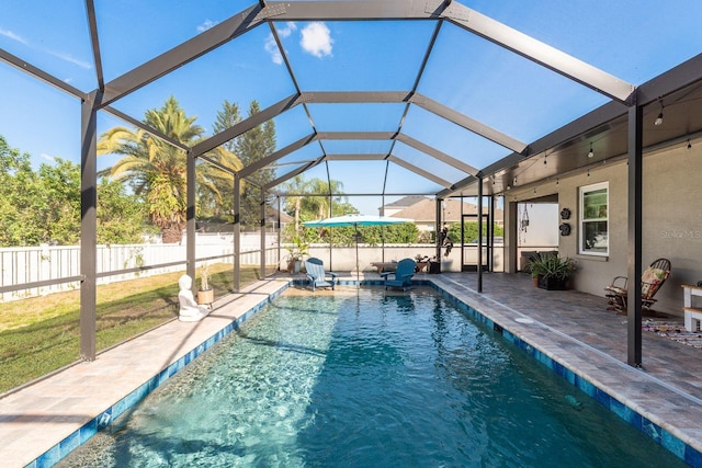 view of pool featuring a patio, a fenced in pool, a lanai, and a fenced backyard