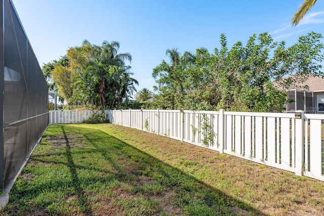 view of yard with a fenced backyard