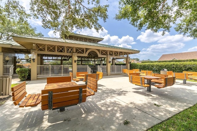 view of home's community with a patio, a gazebo, and an outdoor hangout area