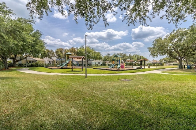 surrounding community with a lawn and playground community