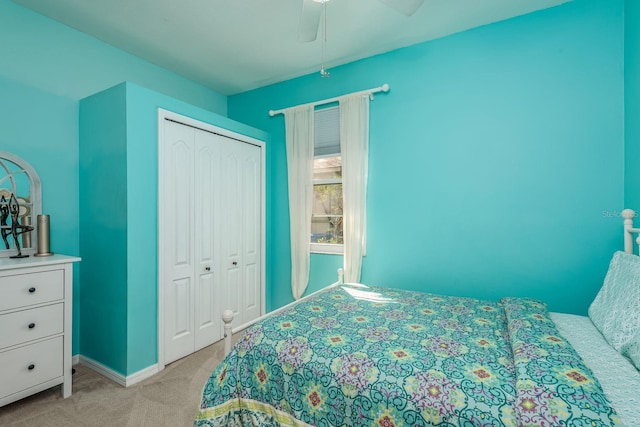 1810 Winsloe Dr, Trinity, FL 34655 - bedroom featuring light carpet, a closet, baseboards, and a ceiling fan
