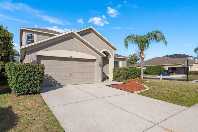 1810 Winsloe Dr, Trinity, FL 34655 - view of front facade featuring an attached garage, stucco siding, concrete driveway, and a front lawn