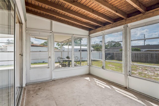 7050 Merrick Ln, Spring Hill, FL 34606 - unfurnished sunroom featuring plenty of natural light and beam ceiling