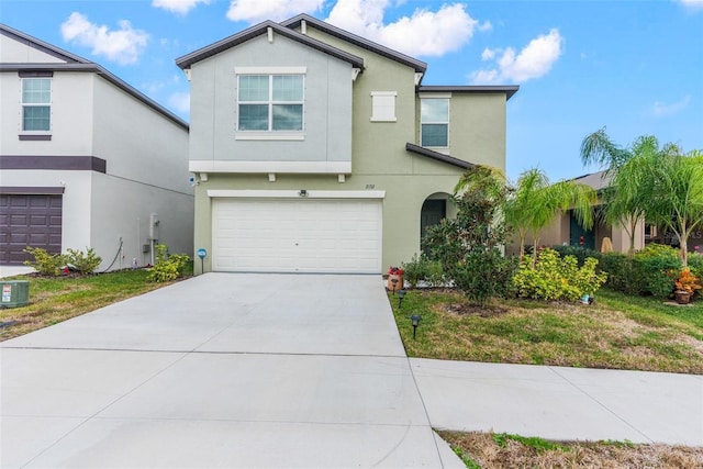 2132 Shining Azul Way, Lutz, FL 33558 - view of front facade featuring stucco siding, a garage, and driveway