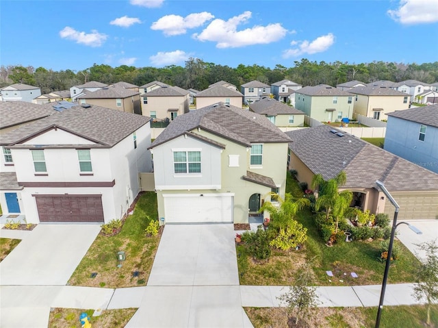2132 Shining Azul Way, Lutz, FL 33558 - traditional home with a residential view, a garage, stucco siding, and concrete driveway