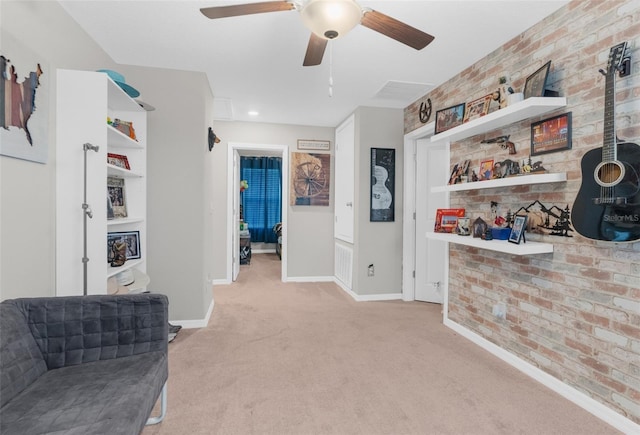 2132 Shining Azul Way, Lutz, FL 33558 - living area with light carpet, ceiling fan, brick wall, and baseboards