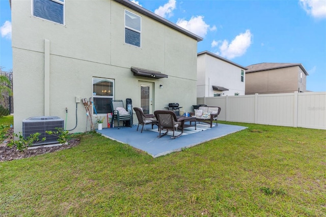 2132 Shining Azul Way, Lutz, FL 33558 - back of property featuring central AC unit, an outdoor living space, a patio area, and stucco siding