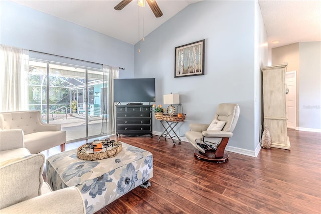 living room featuring a ceiling fan, baseboards, wood finished floors, and high vaulted ceiling