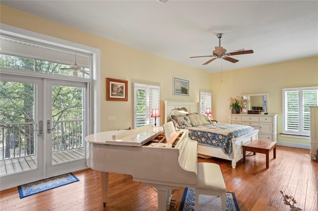bedroom with wood-type flooring, ceiling fan, french doors, and access to exterior