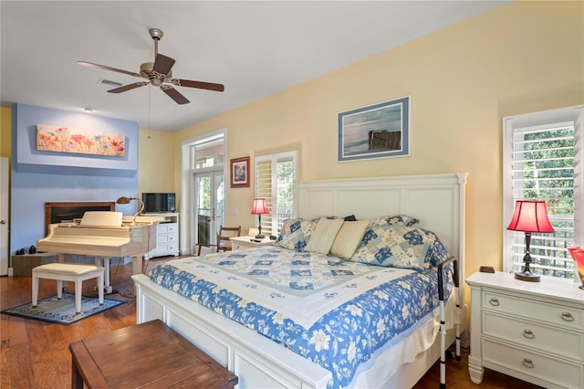 bedroom featuring dark wood finished floors and visible vents