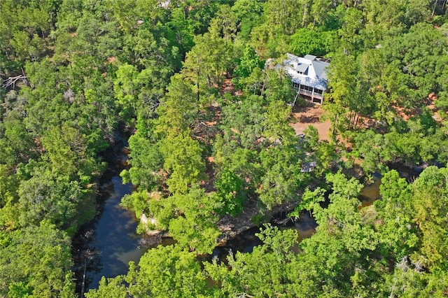 birds eye view of property with a forest view