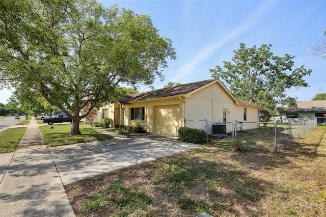 12906 Sandburst Ln, Hudson, FL 34667 - view of side of home with fence, a garage, stucco siding, concrete driveway, and cooling unit