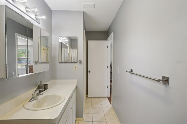 12906 Sandburst Ln, Hudson, FL 34667 - full bath with tile patterned flooring, visible vents, and vanity