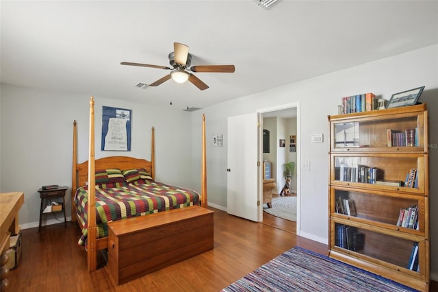 12906 Sandburst Ln, Hudson, FL 34667 - bedroom with ceiling fan, baseboards, visible vents, and wood finished floors