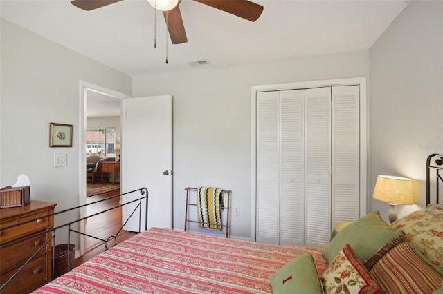 12906 Sandburst Ln, Hudson, FL 34667 - bedroom with ceiling fan, a closet, wood finished floors, and visible vents