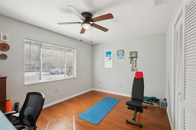 12906 Sandburst Ln, Hudson, FL 34667 - office featuring baseboards, a ceiling fan, wood finished floors, and visible vents