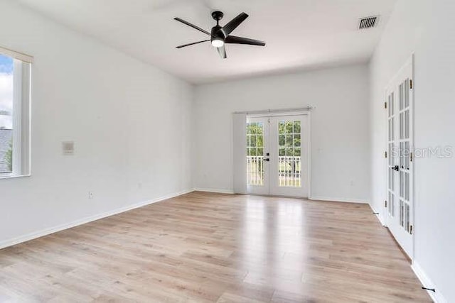 15906 Prince William Pl, Odessa, FL 33556 - spare room with french doors, light wood-style flooring, ceiling fan, and baseboards