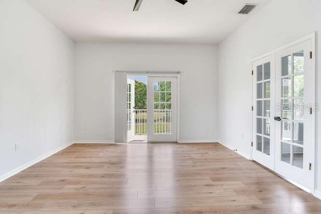 15906 Prince William Pl, Odessa, FL 33556 - empty room featuring french doors, ceiling fan, light wood-type flooring, and baseboards