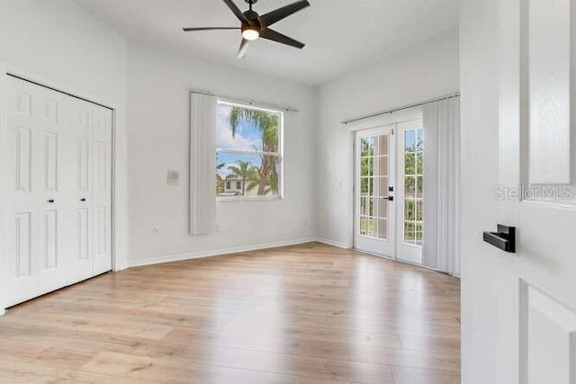 15906 Prince William Pl, Odessa, FL 33556 - unfurnished bedroom featuring access to exterior, french doors, wood finished floors, and a ceiling fan