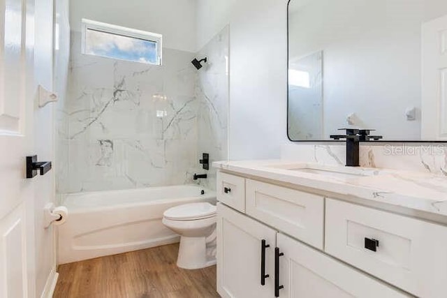 15906 Prince William Pl, Odessa, FL 33556 - full bath with toilet, wood finished floors, shower / bathtub combination, and vanity