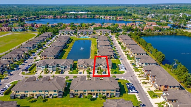 aerial view of residential area with a nearby body of water