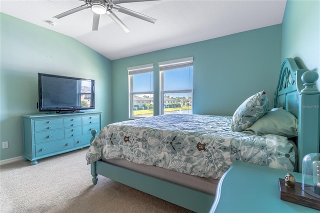 carpeted bedroom with lofted ceiling, ceiling fan, and baseboards