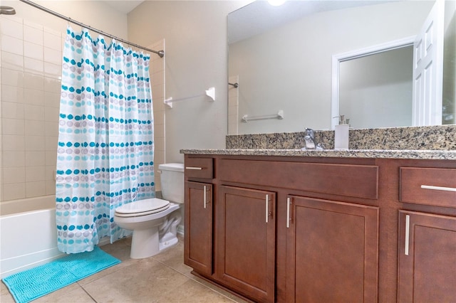 bathroom featuring toilet, tile patterned floors, vanity, and shower / tub combo