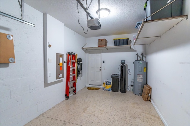 garage featuring water heater, a garage door opener, and electric panel