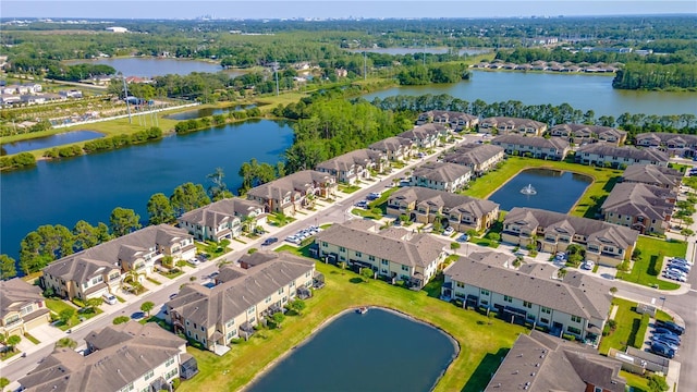 aerial view of residential area with a large body of water