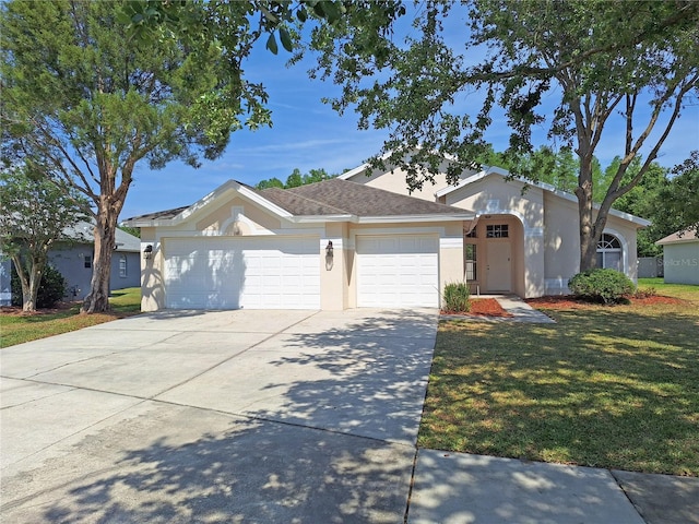19855 Ellendale Dr, Land O Lakes, FL 34638 - ranch-style home with an attached garage, stucco siding, driveway, and a front yard