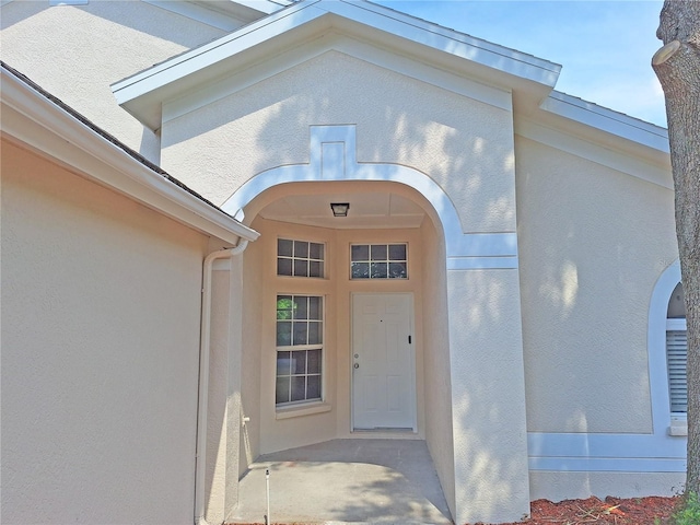 19855 Ellendale Dr, Land O Lakes, FL 34638 - property entrance featuring stucco siding