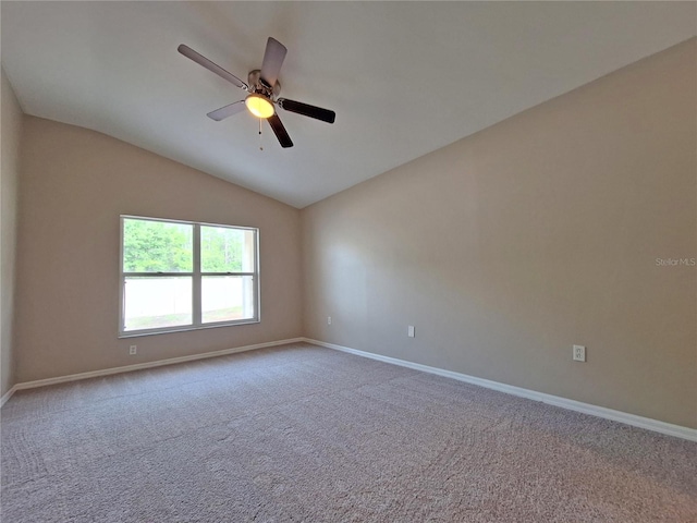 19855 Ellendale Dr, Land O Lakes, FL 34638 - empty room with baseboards, carpet flooring, lofted ceiling, and a ceiling fan