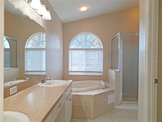 19855 Ellendale Dr, Land O Lakes, FL 34638 - bathroom with tile patterned floors, a bath, a shower stall, and vanity