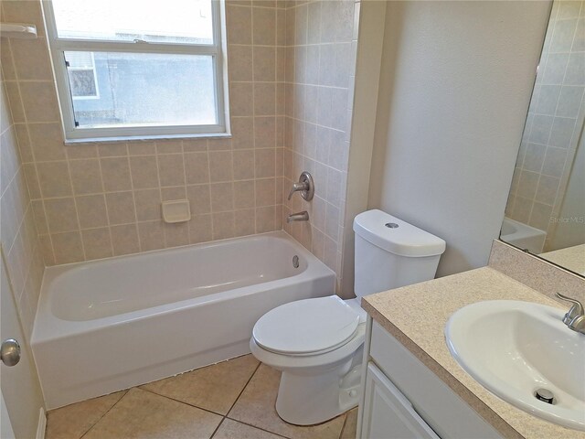 19855 Ellendale Dr, Land O Lakes, FL 34638 - full bathroom with tile patterned flooring, toilet, vanity, and tub / shower combination