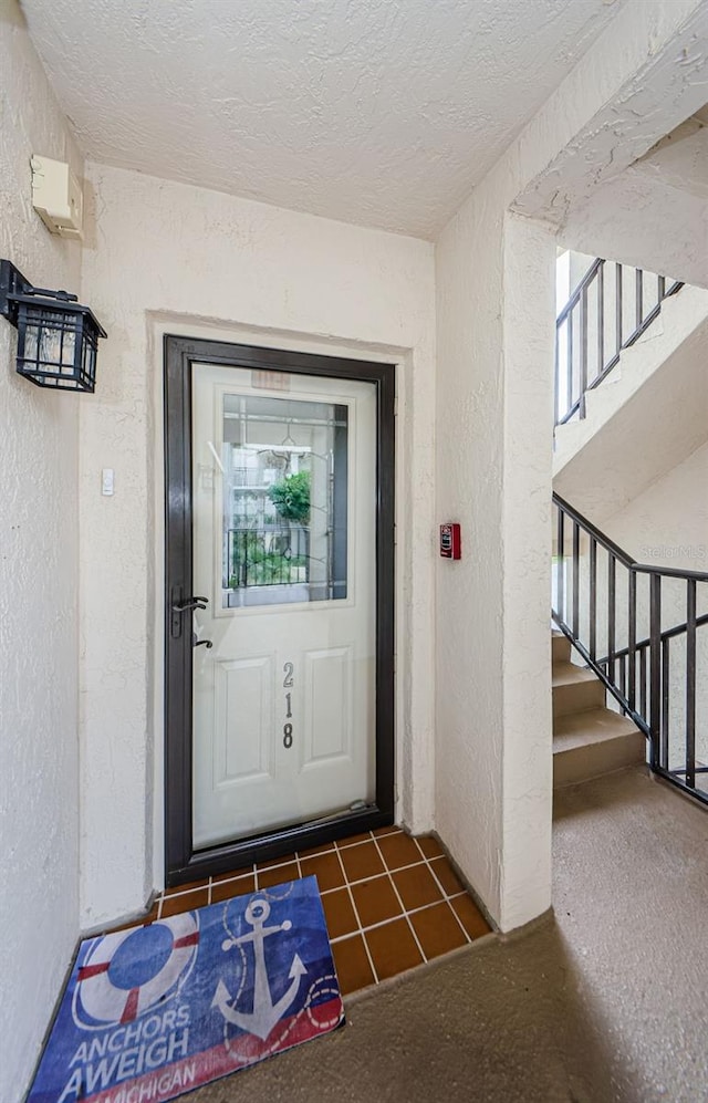 8210 Aquila St Unit 218, Port Richey, FL 34668 - doorway to property with stucco siding