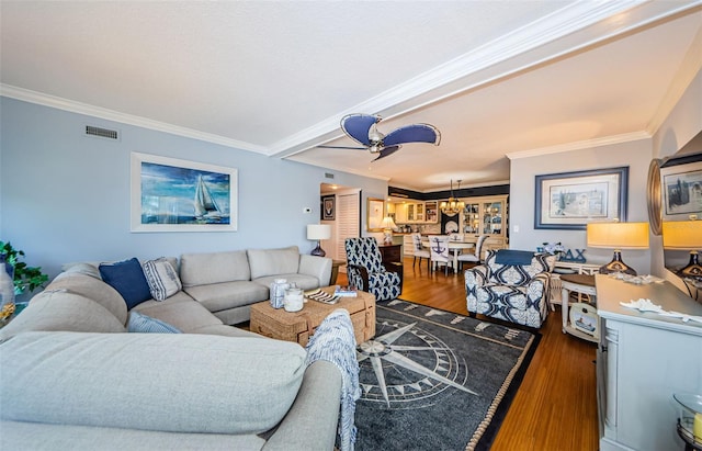 8210 Aquila St Unit 218, Port Richey, FL 34668 - living room featuring wood finished floors, crown molding, and a chandelier