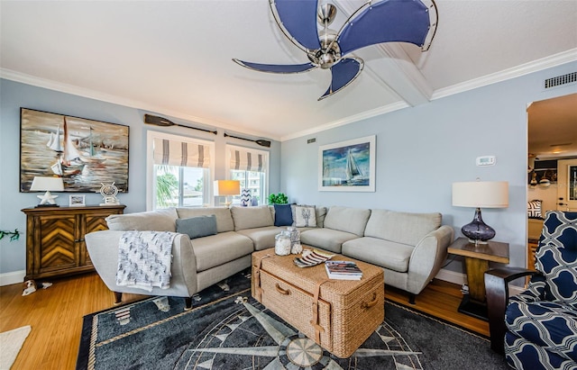 8210 Aquila St Unit 218, Port Richey, FL 34668 - living room with ornamental molding, ceiling fan, wood finished floors, and baseboards