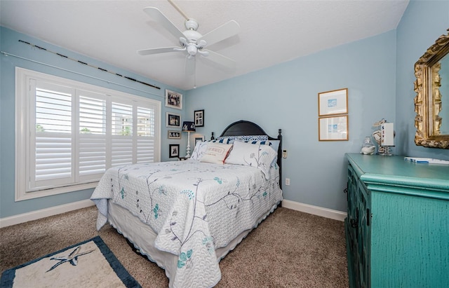 8210 Aquila St Unit 218, Port Richey, FL 34668 - bedroom featuring carpet, baseboards, and a ceiling fan