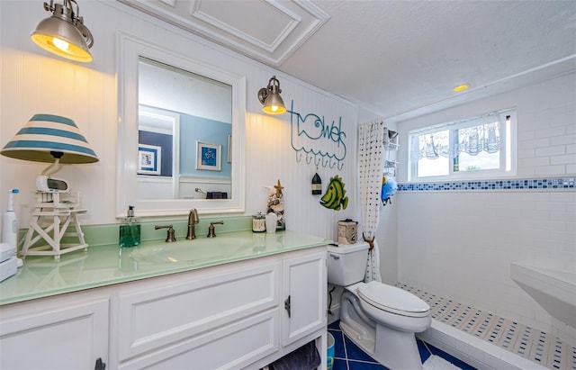 8210 Aquila St Unit 218, Port Richey, FL 34668 - full bathroom with toilet, tiled shower, vanity, and tile patterned flooring