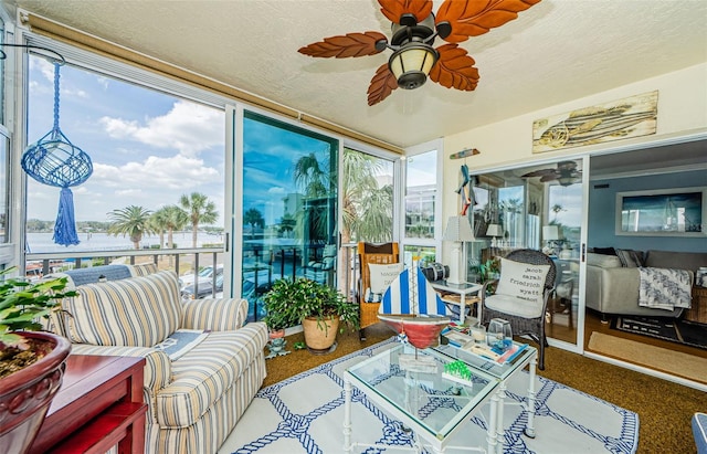 8210 Aquila St Unit 218, Port Richey, FL 34668 - sunroom / solarium featuring expansive windows, a textured ceiling, and carpet floors