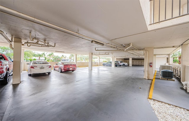 8210 Aquila St Unit 218, Port Richey, FL 34668 - parking garage featuring central AC and fence
